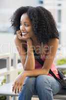 Female student sitting outside