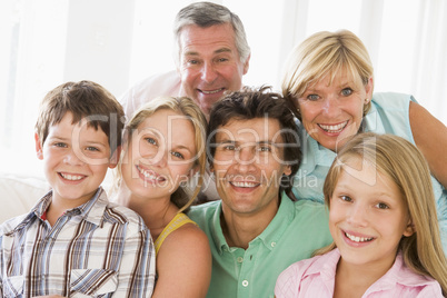 Family indoors together smiling