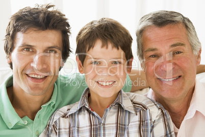 Grandfather with son and grandson smiling