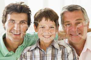 Grandfather with son and grandson smiling