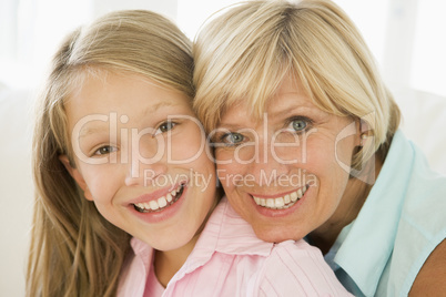 Grandmother and granddaughter smiling