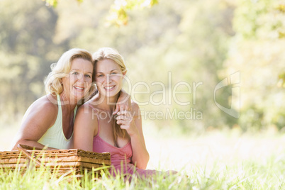 Mother with adult daughter on picnic