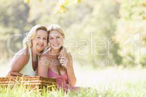 Mother with adult daughter on picnic