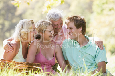 Parents with adult children on picnic