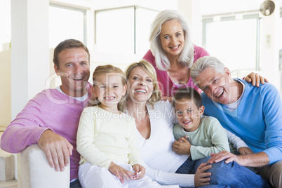 Family sitting indoors smiling