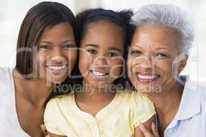 Grandmother with adult daughter and grandchild