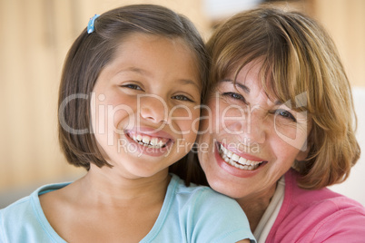 Grandmother and granddaughter smiling