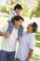 Grandfather with adult son and grandchild