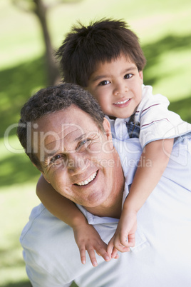 Grandfather piggryback riding grandson