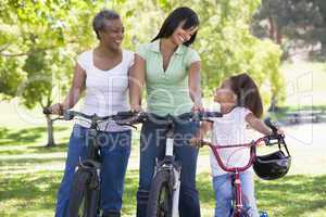 Grandmother mother and granddaughter bike riding
