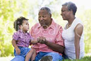 Grandparents with grandson in park