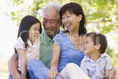 Grandparents laughing with grandchildren