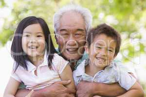 Grandfather posing with grandchildren
