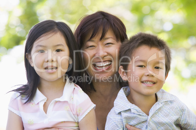 Grandmother laughing with grandchildren