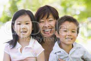 Grandmother laughing with grandchildren