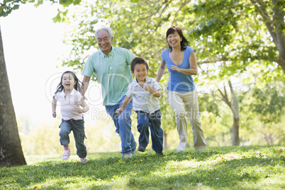 Grandparents running with grandchildren