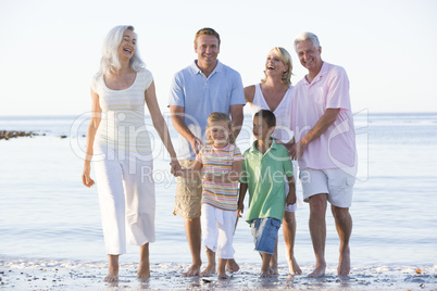 Extended family at the beach smiling