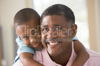Grandfather and grandson smiling