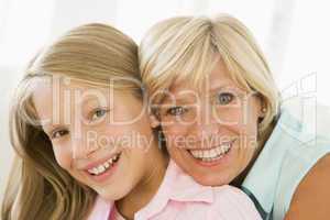 Grandmother and granddaughter smiling