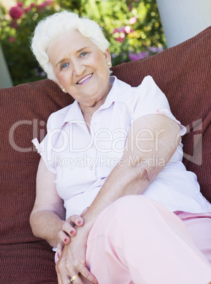 Senior woman sitting on garden chair