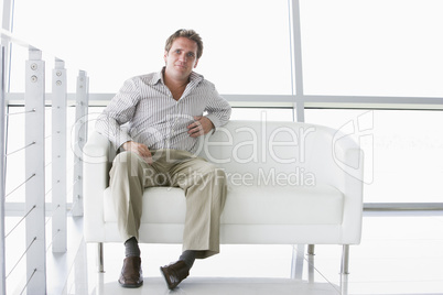 Businessman sitting in office lobby