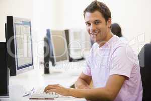 Man in computer room smiling