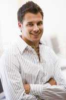 Man standing in computer room smiling