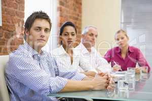 Four businesspeople in boardroom