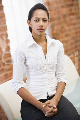 Businesswoman sitting in office space