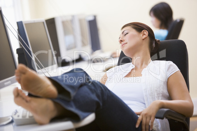 Woman in computer room sleeping