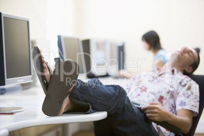 Man in computer room sleeping