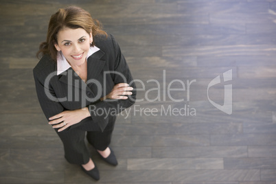 Businesswoman standing indoors smiling