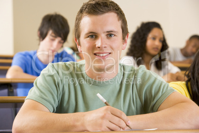 Male college student in a university lecture hall