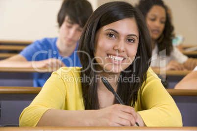 Female college student listening to a university lecture