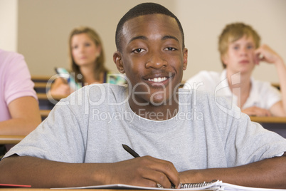 Male college student in a university lecture hall