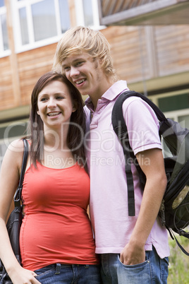 Happy young couple on campus