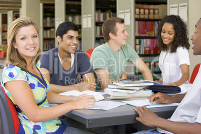 College students studying together in a library