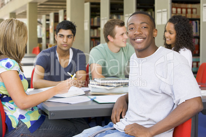 College students studying together in a library