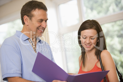 College professor providing guidance to a female student