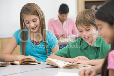 Group of elementary school pupils reading