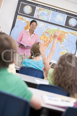 Teacher in elementary school geography class