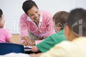 Elementary school teacher with pupils