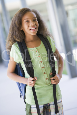 Elementary school pupil outside building