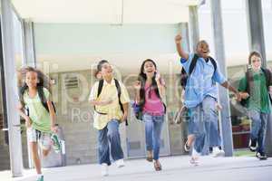 Elementary school pupils running outside