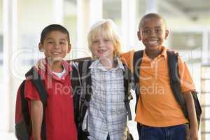Three kindergarten boys standing together