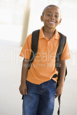 Portrait of kindergarten boy with backpack