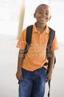 Portrait of kindergarten boy with backpack