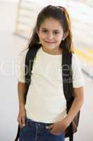 Portrait of kindergarten girl with backpack