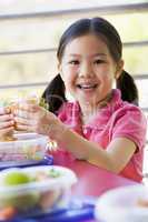 Girl eating lunch at kindergarten