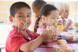 Kindergarten children eating lunch